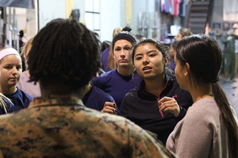 U.S. Marine Corps poolees ask questions about physical fitness to Staff Sgt. Jennifer Landry during Marine Corps Recruiting Station Detroit’s all-hands female pool function December 10, 2016, in Troy, Michigan. The purpose of the pool function was to help prepare the poolees both physically and mentally for the challenges of recruit training at Marine Corps Recruit Depot Parris Island, South Carolina. During the function there was a question and answer period where the ladies were able to ask female Marines question about daily life aboard the depot. (U.S. Marine Corps photo by Sgt. J. R. Heins/ Released)