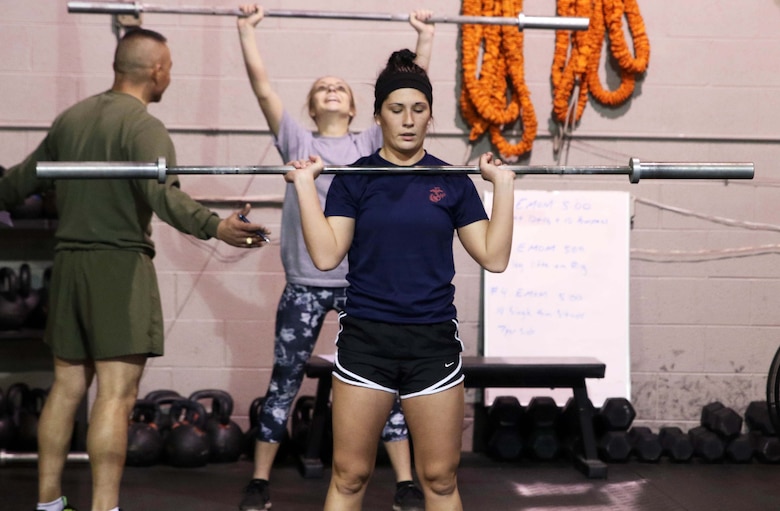 U.S. Marine Corps Poolee Maelym R. Russo performs push presses during a Marine Corps Recruiting Station Detroit’s all-hands female pool function December 10, 2016, in Troy, Michigan. Russo a native of Rockwood, Michigan, was recruited out of Recruiting Sub Station Wyandotte’s office and is slated to attend Marine Corps Recruit Depot Parris Island, South Carolina, in April 2017. (U.S. Marine Corps photo by Sgt. J. R. Heins/ Released)