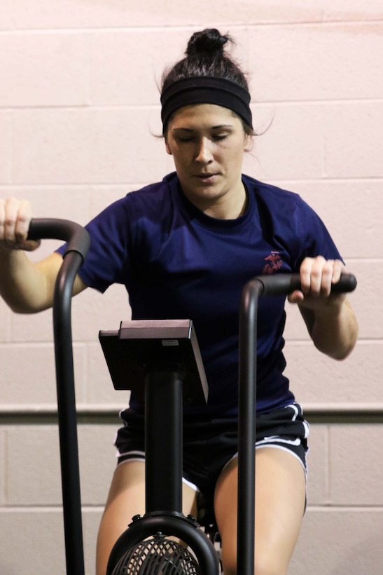 U.S. Marine Corps Poolee Maelym R. Russo conducts a max effort sprint on an Assault Air Bike during a Marine Corps Recruiting Station Detroit’s all-hands female pool function December 10, 2016, in Troy, Michigan. Russo a native of Rockwood, Michigan,  was recruited out of Recruiting Sub-Station Wyandotte’s office and is scheduled to attend Marine Corps Recruit Depot Parris Island, South Carolina, in April 2017. (U.S. Marine Corps photo by Sgt. J. R. Heins/ Released)