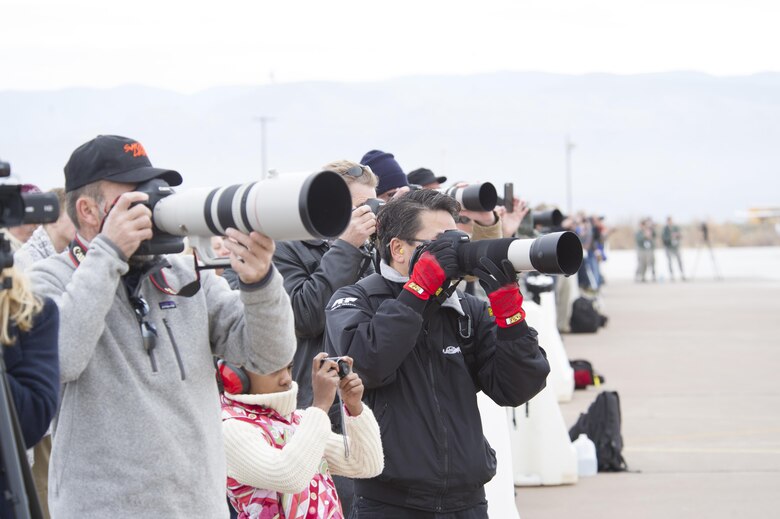 Spectators photograph the last flight of the QF-4 Phantom during the QF-4 Phinal Phlight event Dec. 21, 2016 at Holloman Air Force Base, N.M. Hundreds of people were in attendance to commemorate the aircraft’s retirement, marking the end of the aircraft’s 53 years of service to the Air Force. (U.S. Air Force photo by Master Sgt. Matthew McGovern) 