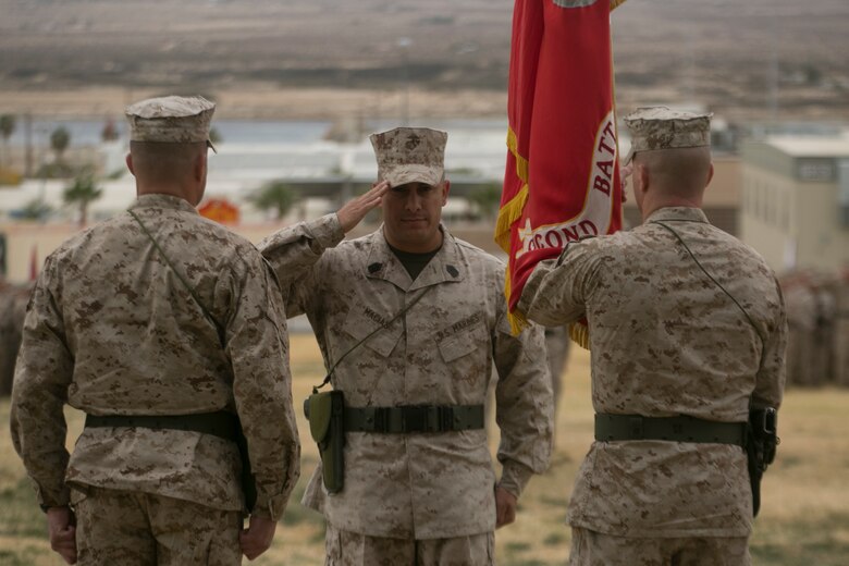 Sgt. Maj. Gabriel E. Macias, battalion sergeant major, 2nd Battalion, 7th Marine Regiment, salutes Lt. Col. Christopher T. Steele, outgoing commander and Lt. Col Jonathan Q. Kenney, oncoming commander, 2nd Battalion, 7th Marine Regiment, during the unit’s change of command ceremony at Lance Cpl. Torrey L. Gray Field aboard Marine Corps Air Ground Combat Center Twentynine Palms, Calif., Dec. 15, 2016. ( Official Marine Corps Photo by Cpl. Julio McGraw/Released)