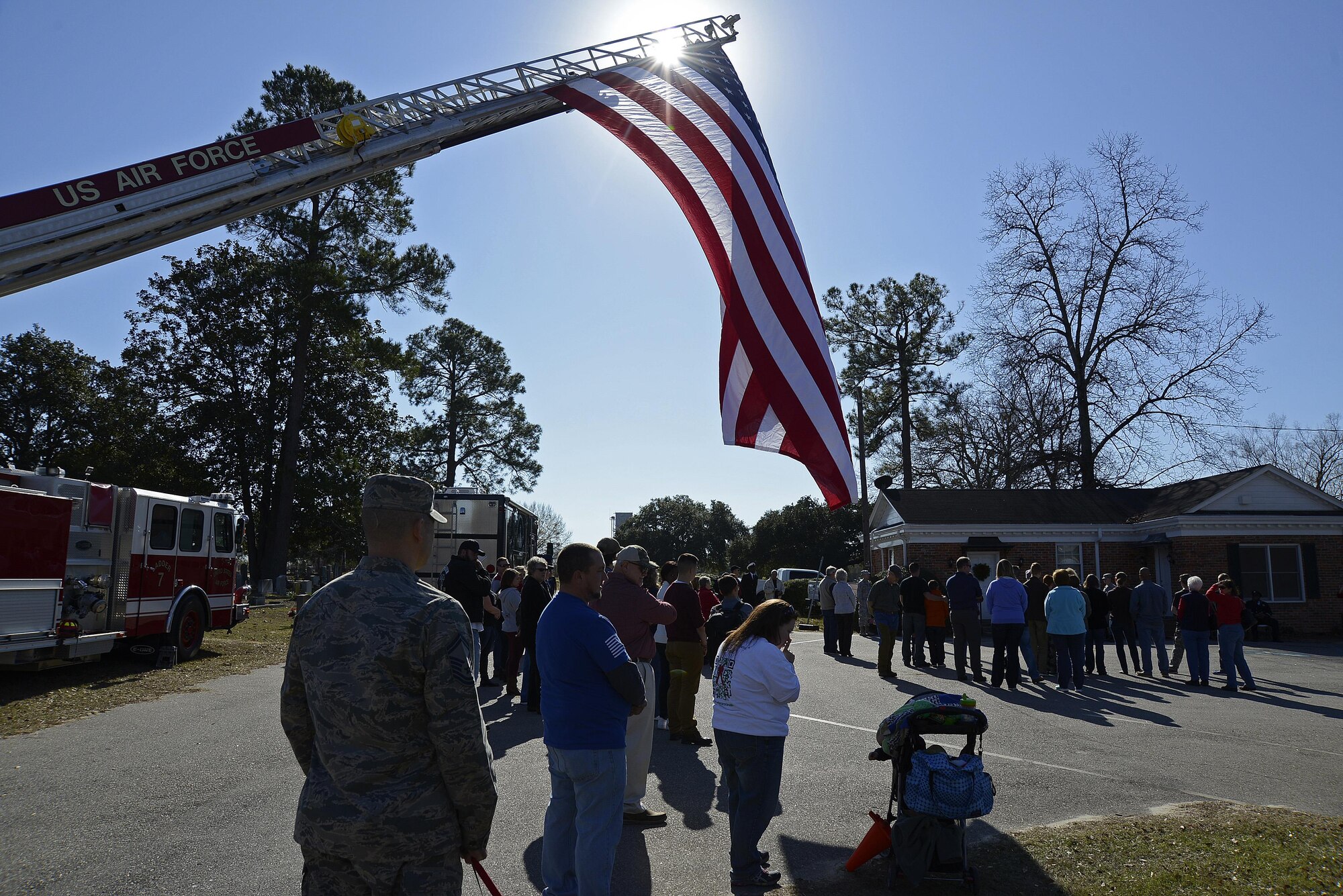 U.S. military members, civilians and veterans come together to remember veterans who have passed away and military members who made the ultimate sacrifice at Sumter Cemetery in Sumter, S.C., Dec. 17, 2016. Over 100 wreaths donated by sponsors were placed on the fence of Sumter Cemetery. (U.S. Air Force photo by Airman 1st Class BrieAnna Stillman) 