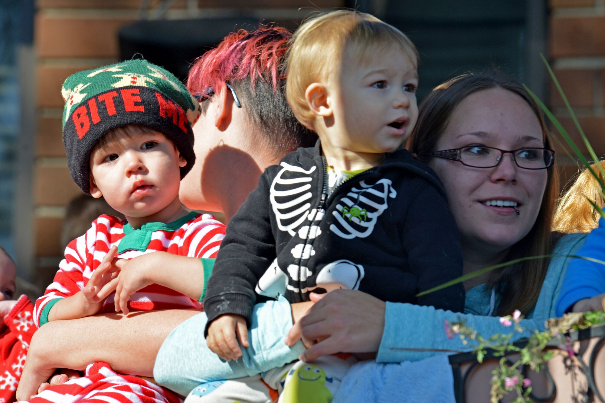 Team Shaw children await the arrival of Santa Claus on the deck of the Carolina Skies Club and Conference Center at Shaw Air Force Base, S.C., Dec. 17, 2016. Santa arrived on a fire truck and was greeted by the children outside the club. (U.S. Air Force photo by Airman 1st Class Destinee Sweeney)