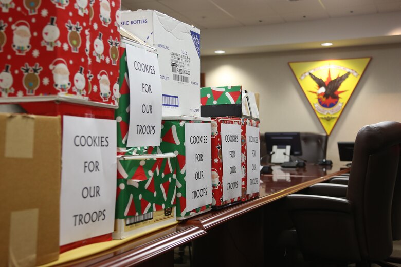 Boxes of donated cookies are stacked on a conference table during an annual cookie drop aboard Marine Corps Air Station Cherry Point, N.C., Dec. 22, 2016. The Carteret County’s Chamber of Commerce’s Military Affairs Committee donated 26 boxes of cookies to Marines and Sailors on duty aboard the air station. Elementary school students from Carteret County added homemade Christmas cards in the boxes to wish the service members a happy holiday season. (U.S. Marine Corps photo by Cpl. Jason Jimenez/ Released)