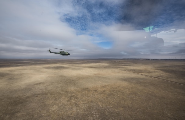 A 37th Helicopter Squadron UH-1N Huey journeys to a launch facility for emergency security response training in the F.E. Warren Air Force Base, Wyo., missile complex, Dec. 16, 2016. The 90th MW sustains 150 Minuteman III ICBMs, and the associated launch facilities 9,600 square miles across three states. (U.S. Air Force photo by Staff Sgt. Christopher Ruano)