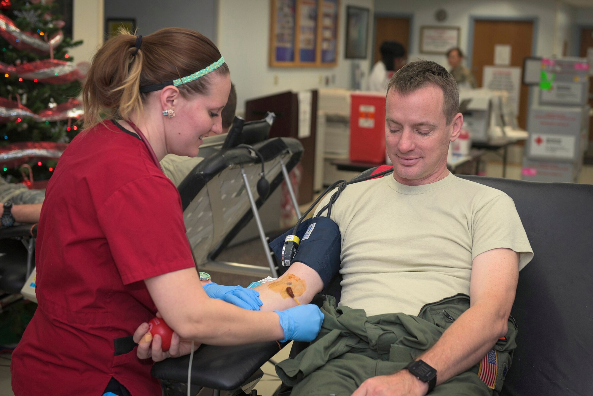 161214-Z-EU280-2020: U.S. Air Force Lt. Col. Eric Dolan, a C-130 Hercules navigator with the 182nd Operations Support Squadron, Illinois Air National Guard, gets sterilized with iodine before donating blood at an American Red Cross blood drive at the 182nd Airlift Wing in Peoria, Ill., Dec. 14, 2016. The wing’s company grade officers council hosted the event as a way for unit members to give back to their communities. (U.S. Air National Guard photo by Tech. Sgt. Lealan Buehrer)