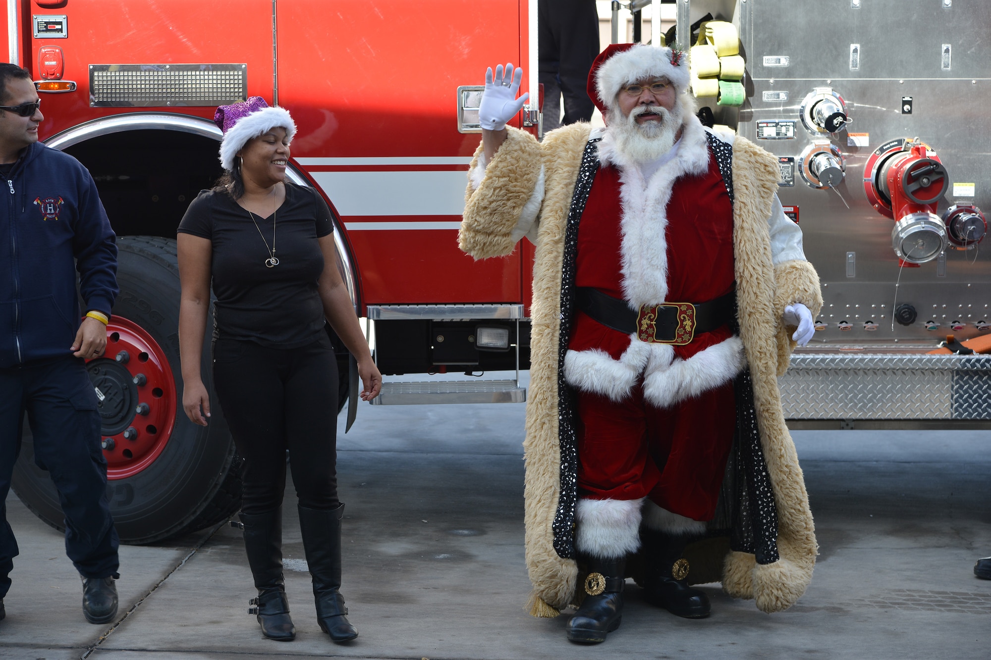 Santa Claus makes a stop at Operation Holiday Cheer, one of Kirtland's biggest charitable events of the year. The event, hosted annually by the Kirtland Air Force Base Fire Department, delivered more than 800 new, high-quality toys to children Dec. 14.  More than 1,700 members of the community received a full holiday meal, with turkey, enchiladas, posole, mashed potatoes and desserts. 