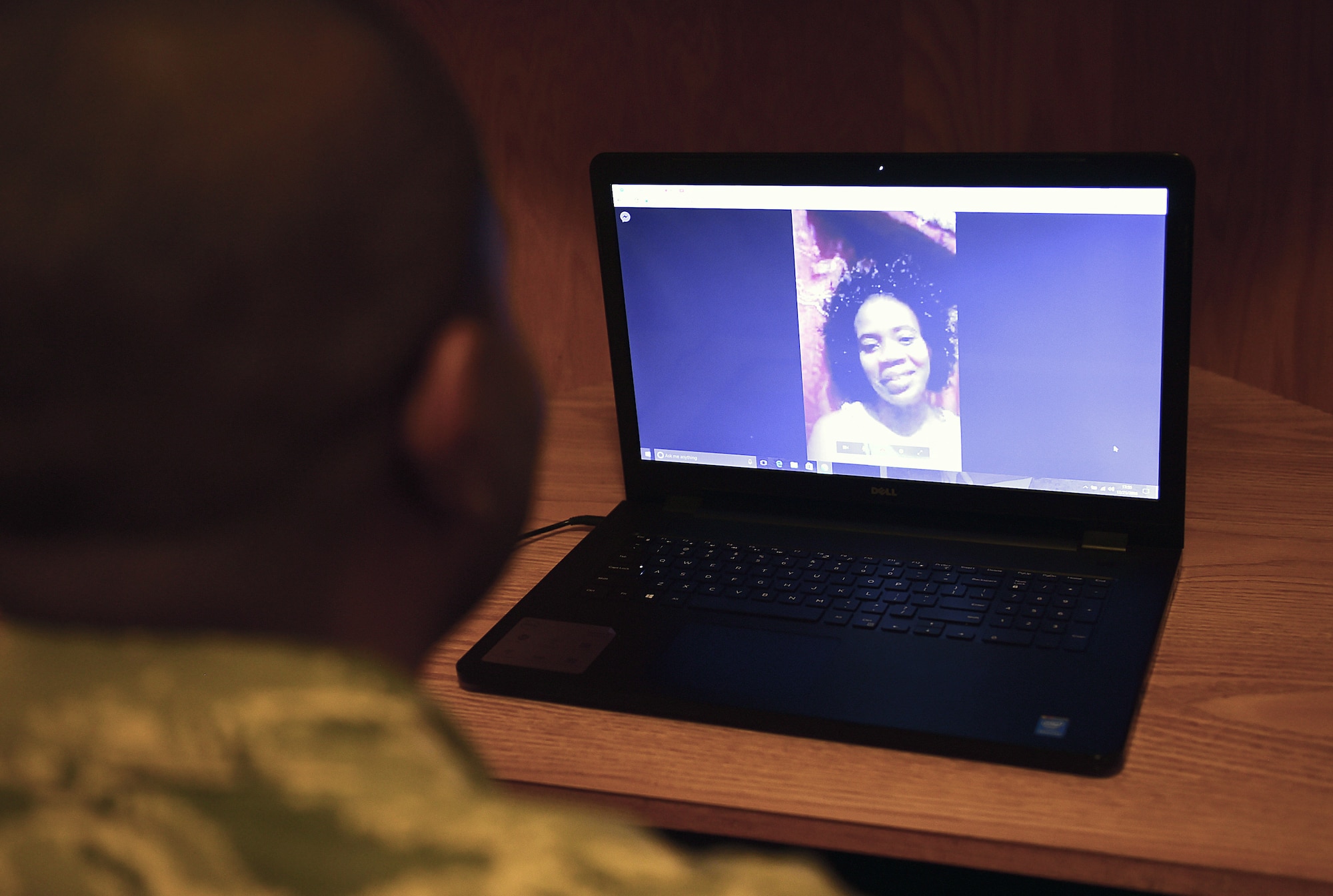 Airman Alfred Grannell, 460th Space Wing Comptroller Squadron budget analyst, talks with his fiancée, Debbie Coghiel of Portmore, Jamaica, through Facebook video chat Dec. 21, 2016, on Buckley Air Force Base, Colo. Grannell uses video chat to communicate with his family and fiancée in his native country of Jamaica. (U.S. Air Force photo by Airman Jacob Deatherage)
