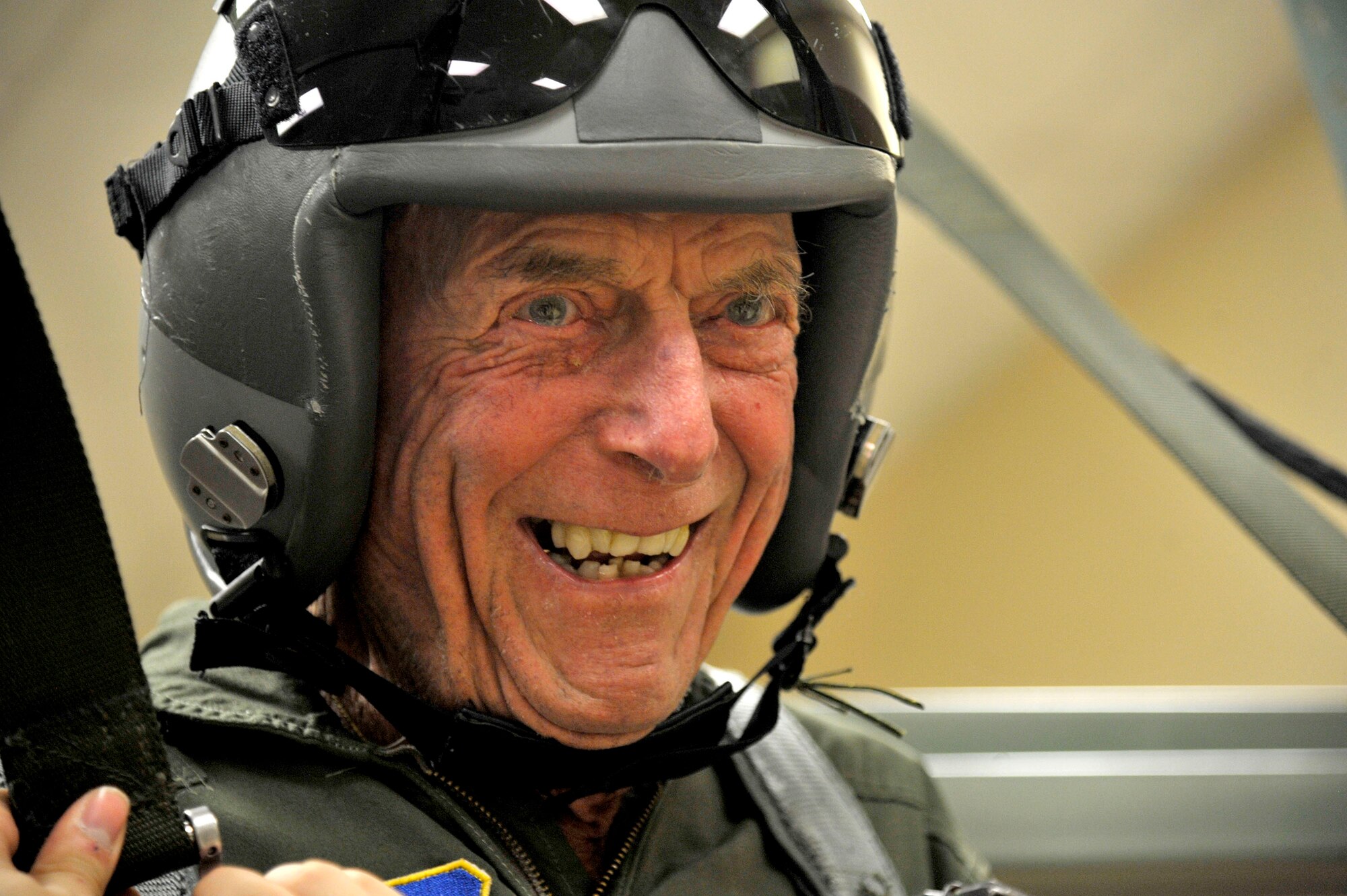 Retired Capt. Jerry Yellin, a former U.S. Army Air Corps fighter pilot, dangles in the parachute trainer during pre-flight orientation training Dec. 16, 2016, at Laughlin Air Force Base, Texas.  Now 92, he enlisted two months after the bombing of Hickam Air Field and Pearl Harbor, Hawaii, on his 18th birthday in February of 1942. After graduating from Luke Air Field as a fighter pilot in August 1943, he spent the remainder of the war flying P-40, P-47 Thunderbolt and P-51 Mustang combat missions in the Pacific with the 78th Fighter Squadron, known as the "Bushmasters." (U.S. Air Force photo/Tech. Sgt. Mike Meares)