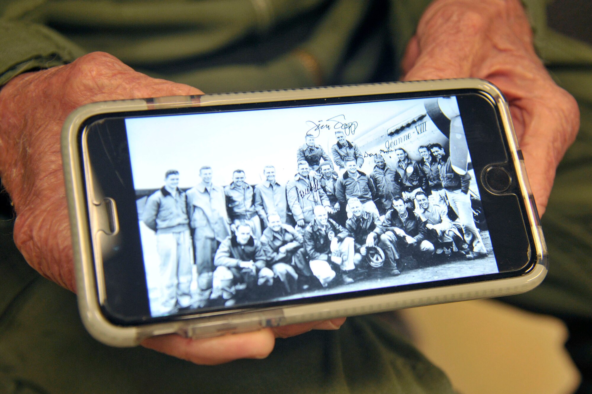 Capt. Jerry Yellin, a former U.S. Army Air Corps fighter pilot, shows a photo taken in 1944 toward the end of World War II, of the 78th Fighter Squadron "Bushmasters," during his visit to Laughlin Air Force Base, Texas, Dec. 14, 2016. Yellin enlisted two months after the bombing of Hickam Air Field and Pearl Harbor, Hawaii, on his 18th birthday. He was a part of the squadron who flew the final combat mission in the Pacific at the conclusion of World War II. (U.S. Air Force photo/Tech. Sgt. Mike Meares)