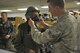 Capt. Jerry Yellin, a former U.S. Army Air Corps fighter pilot, is fitted for a helmet and face mask by Senior Airman Todd Brackenbury, 47th Operations Support Squadron, in preparation for an orientation flight at Laughlin Air Force Base, Texas, Dec. 16, 2016. Yellin, 92, enlisted two months after the bombing of Hickam Air Field and Pearl Harbor, Hawaii, on his 18th birthday. After graduating from Luke Air Field as a fighter pilot in August of 1943, he spent the remainder of the war flying P-40, P- 47 Thunderbolt and P-51 Mustang combat missions in the Pacific with the 78th Fighter Squadron, known as the 