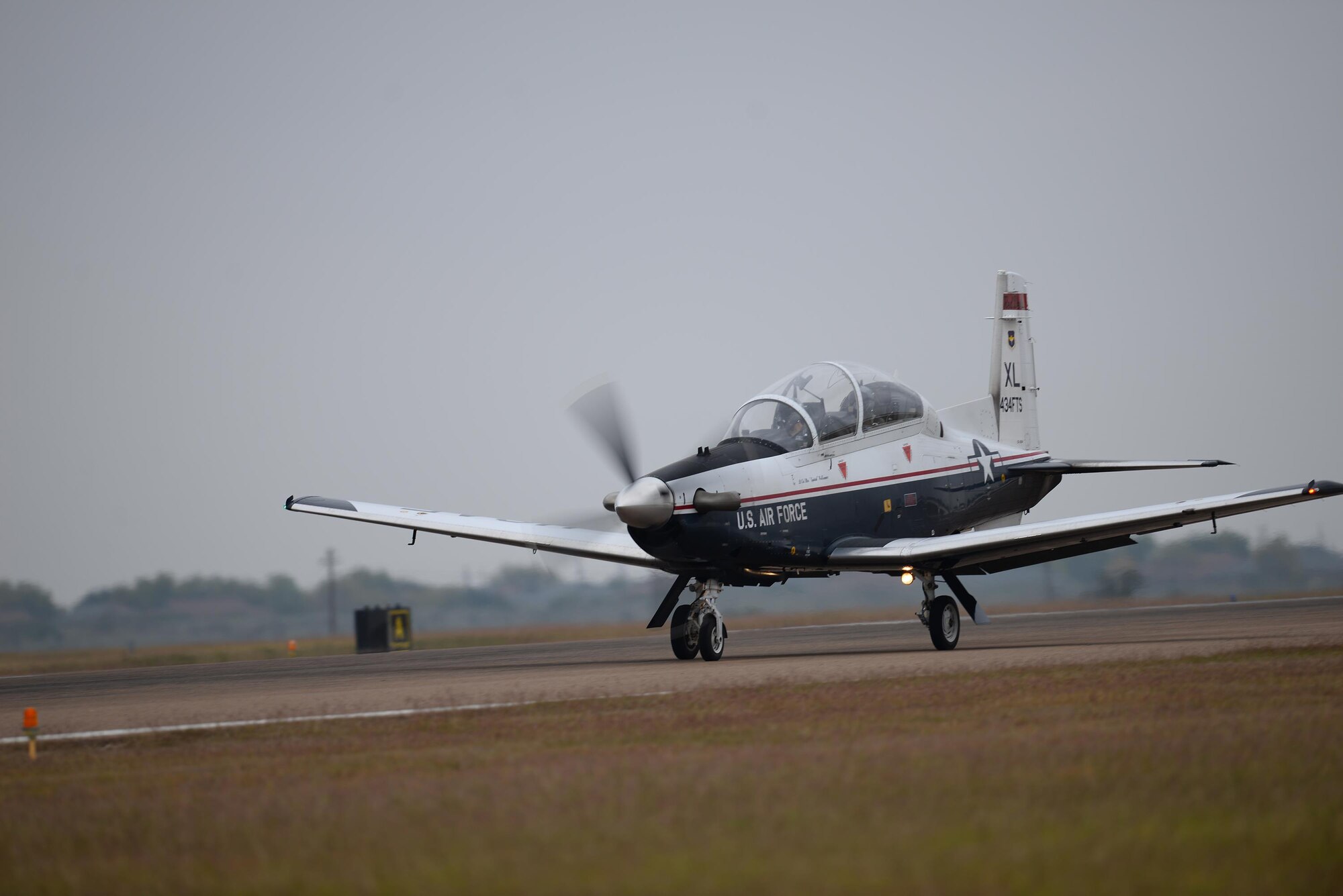 Capt. Steven Parsons, 47th Student Squadron assistant director of operations and Jerry Yellin, author and retired U.S. Army Air Corps Captain, take off in a T-6A Texan II on Laughlin Air Force Base, Texas, Dec. 15, 2016. Yellin visited Laughlin as the guest speaker for Specialized Undergraduate Pilot Training class 17-03’s graduation and was given an orientation flight while here. (U.S. Air Force photo/Senior Airman Ariel D. Partlow)