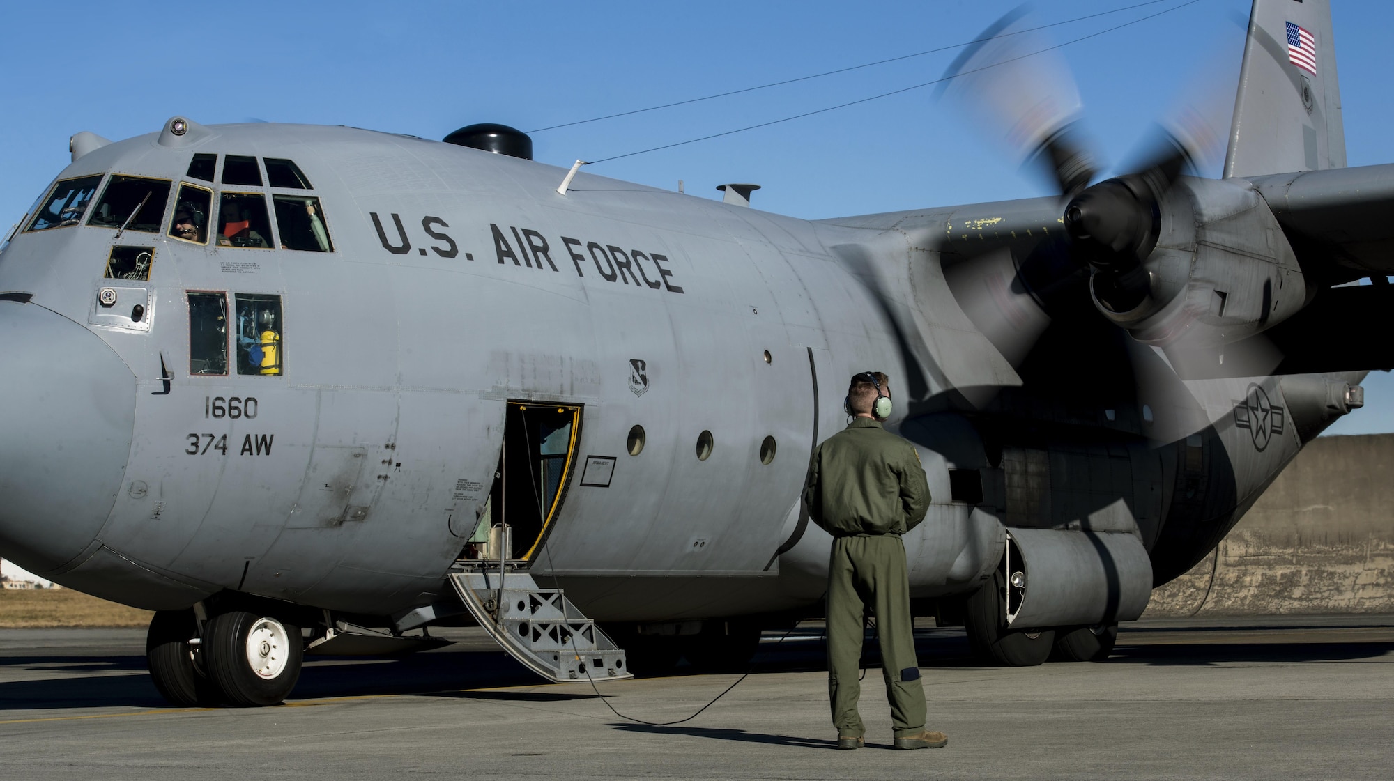 Airman 1st Class Christian Williams, 36th Airlift Squadron C-130 loadmaster, performs pre-flight checks on a C-130 Hercules on Dec. 15, 2016, at Yokota Air Base, Japan. Williams ensures the C-130 is ready for Yokota’s last flight of the year. (U.S. Air Force photo by Airman 1st Class Juan Torres)