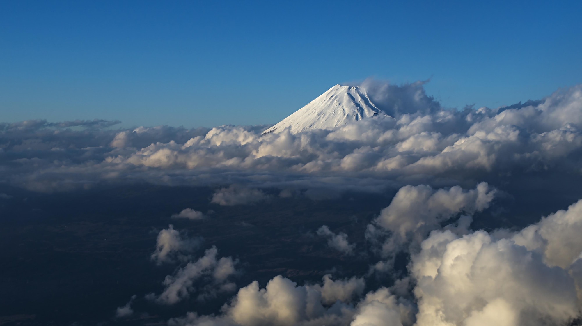 Mt. Fuji is seen from the cockpit of a C-130 Hercules on Dec. 15, 2016, near Camp Fuji, Japan. During the flight, two heavy cargos were dropped over their drop zone. (U.S. Air Force photo by Airman 1st Class Juan Torres)