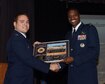 Capt. Joshua Rower, Specialized Undergraduate Pilot Training Class 17-03 class leader, poses for a picture with Col. Brandon Parker, Vice Commander, 2nd Bomb Wing, Barksdale Air Force Base, Louisiana, at the 17-03 SUPT graduation Dec. 16, 2016, at the Kaye Auditorium on Columbus Air Force Base, Mississippi. During his speech, Parker charged the graduates to educate, innovate and motivate. (U.S. Air Force photo by Melissa Doublin)