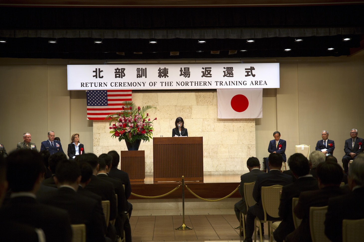 Japanese Minister of Defense Tomomi Inada makes opening remarks during the Northern Training Area Land Return Ceremony Dec. 22 in Nago City, Okinawa, Japan. Representatives from the United States government, U.S. Forces Japan and the Government of Japan gathered for the ceremony that represented the return of thousands of acres of land previously utilized as part of the Northern Training Area. The return included approximately 9,852 acres of land and marks the largest land return from U.S. Forces Japan since 1972. The return is one of the many U.S. Forces Japan efforts to consolidate U.S. presence on Okinawa and ensure minimal environmental impact on Okinawa’s natural resources.