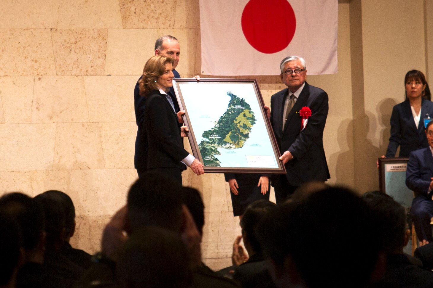 U.S. Ambassador to Japan Caroline Kennedy, left, poses for a photo with Seikyu Iju, the mayor of Higashi village at the conclusion of the Northern Training Area Land Return Ceremony Dec. 22 in Nago City, Okinawa, Japan. The ceremony honored the return of more than 9,852 acres of land from U.S. Forces Japan that was previously utilized as part of the Northern Training Area. The land return marks the largest land return since 1972. During the ceremony, government representatives from the Japan and the United States gave remarks regarding the return of the land and the importance of the Japan-U.S. alliance.