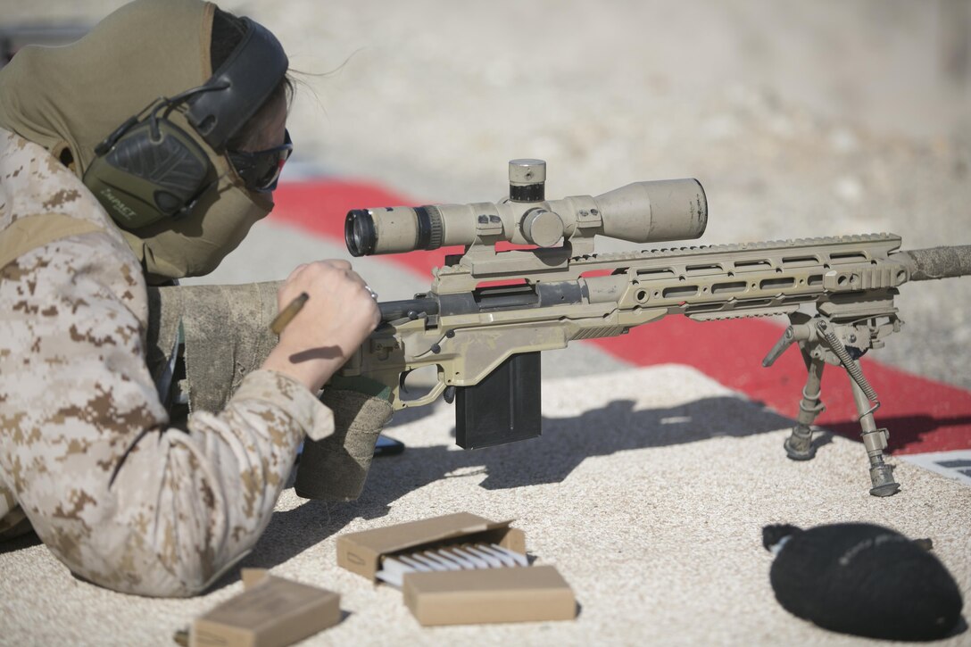 Cpl. Crystal Guerrero, Combat Center Shooting Team, reloads an M40A1 during the High Desert Regional Shooting Match at Marine Corps Air Ground Combat Center Twentynine Palms, Calif., Dec. 16, 2016. 