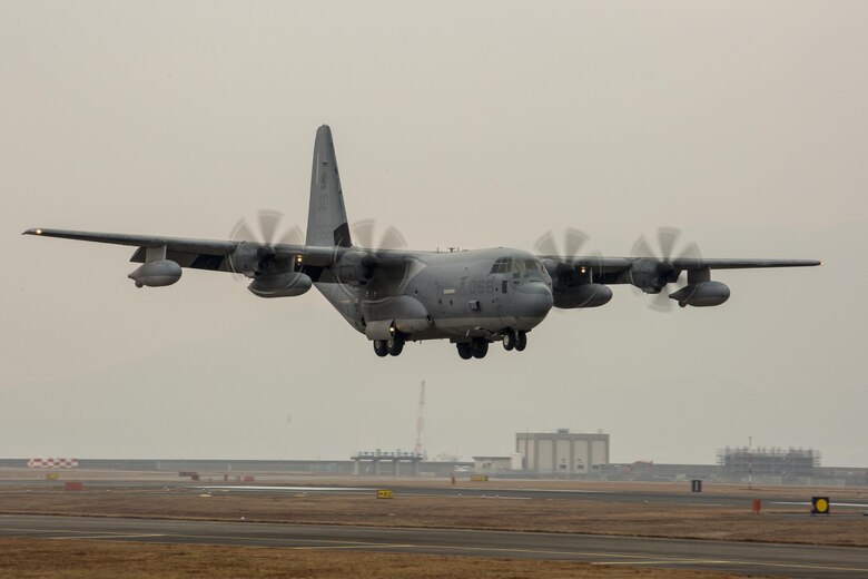 A KC-130J Hercules with Marine Aerial Refueler Transport Squadron (VMGR) 152 prepares to land during aircraft landing zone training at Marine Corps Air Station Iwakuni, Japan, Dec. 21, 2016. The training allows Marines with Marine Air Control Squadron 4 Detachment Bravo, Marine Air Traffic Control Mobile Team (MMT), to gain experience, practice constructing an expeditionary airfield, and complete training and readiness requirements. VMGR-152 assisted MACS-4 Detachment Bravo while also completing their training and readiness requirements. (U.S. Marine Corps photo by Cpl. Aaron Henson)