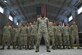 Staff Sgt. Preston Moten, a 20th Equipment Maintenance Squadron aerospace ground equipment schedule and training monitor, stands in front of 20th EMS Airmen at Shaw Air Force Base, S.C., Dec. 9, 2016. Moten had retained negative habits from his life prior to the Air Force that jeopardized his career and the safety of his fellow Airmen, but used the support and guidance offered by his team members to break those habits and become more resilient. (U.S. Air Force photo/Airman 1st Class Kathryn R.C. Reaves)