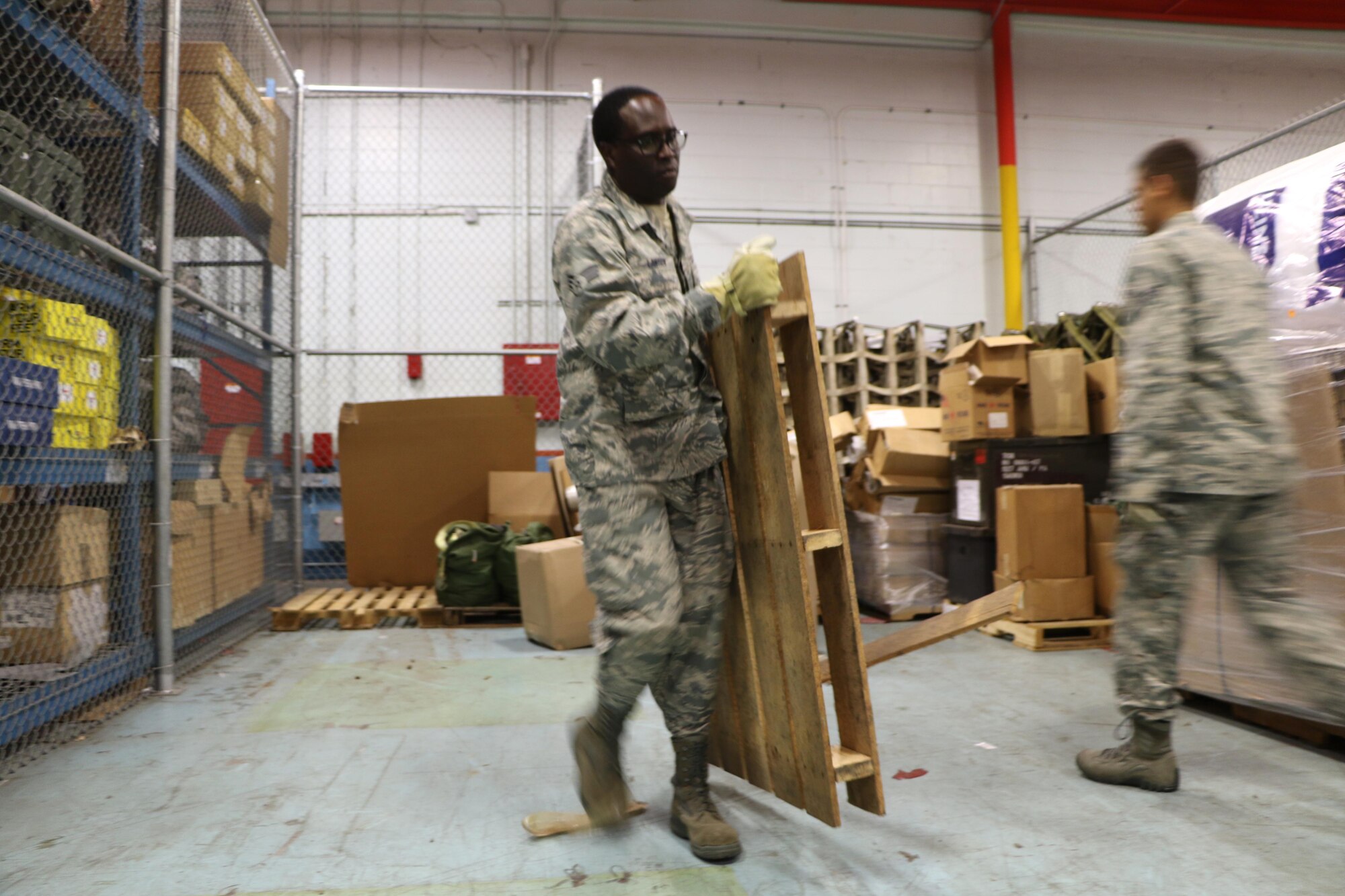 Senior Airmen Thomas Perez and William Lawson, 927th Logistics Readiness Squadron material managers move boxes on Dec. 20, 2016 at MacDill Air Force Base, FL. Perez and Lawson were in during the week to assist the 927 LRS with clearing storage space. (U.S. Air Force photo by Senior Airman Xavier Lockley)