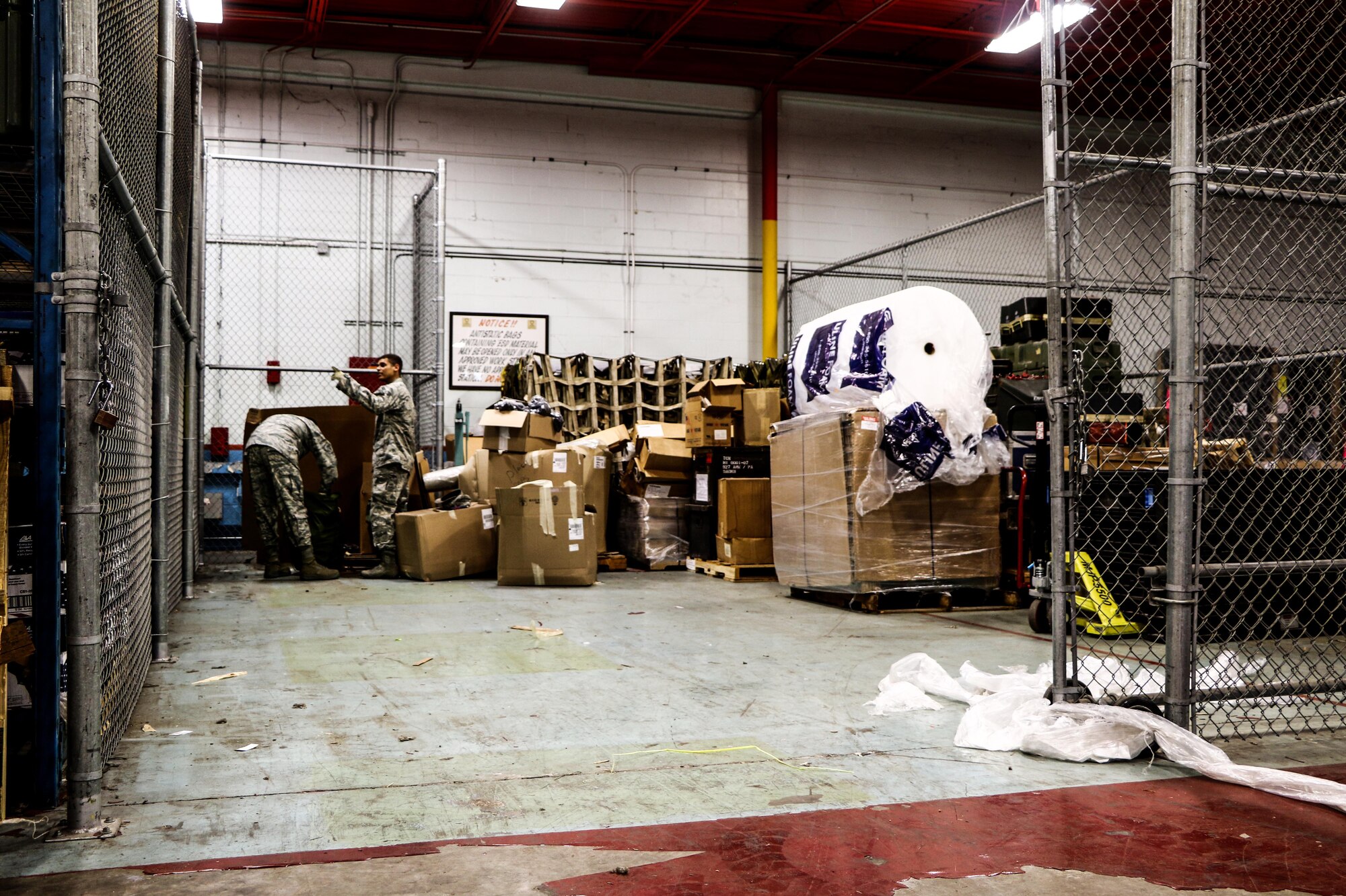 Senior Airmen Thomas Perez and William Lawson, 927th Logistics Readiness Squadron material managers move boxes on Dec. 20, 2016 at MacDill Air Force Base, FL. Perez and Lawson were in during the week to assist the 927 LRS with clearing storage space. (U.S. Air Force photo by Senior Airman Xavier Lockley)