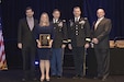 Christine Ploschke, former Energy Branch manager for the Army Reserve’s 99th Regional Support Command (second from left), receives a 2016 Federal Energy and Water Management Award from the Department of Energy during a ceremony Dec. 7 in Washington, D.C. This is the third national energy and water management award the 99th RSC has won in as many years as it continues to support readiness by providing the best possible facilities in which Soldiers can work and train. This latest recognition follows a DoE Federal Energy and Water Management Award Ploschke and her team earned for accomplishments in fiscal year 2015, as well as the Army “Small Group” Energy and Water Management Award they received for FY14.