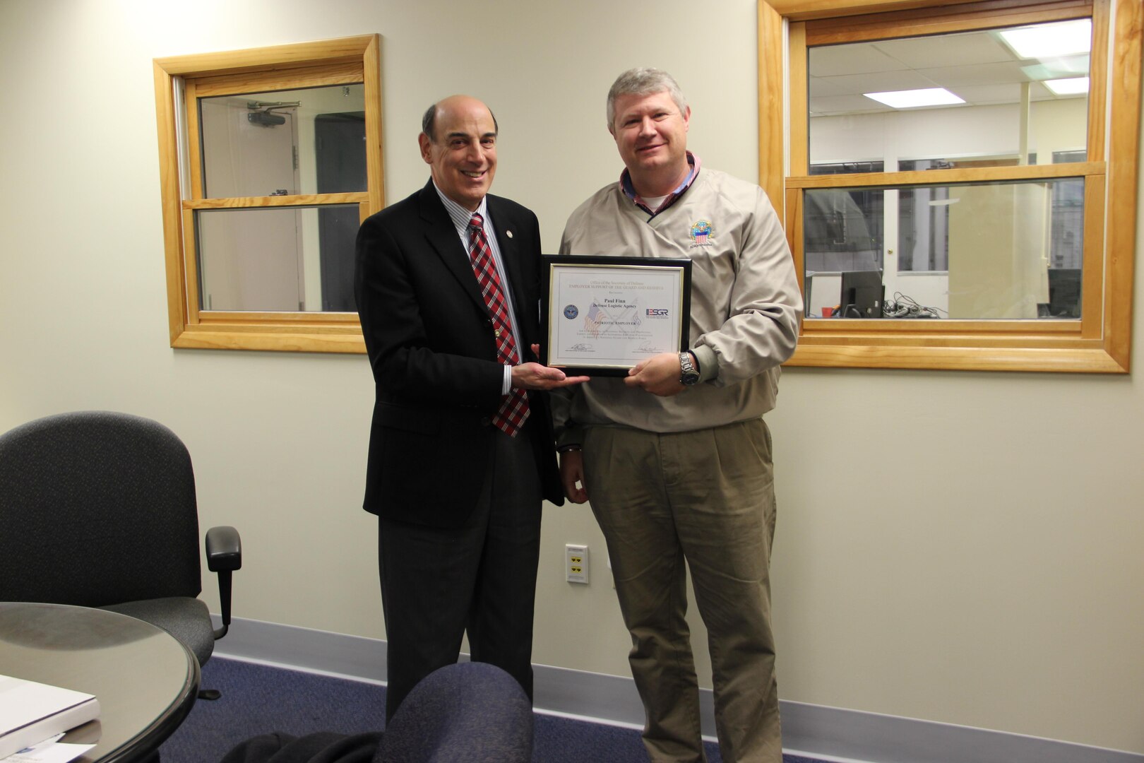 Paul Finn, Eastern Distribution Center operations manager at DLA Distribution Susquehanna, Pa., is presented the Employer Support of the Guard and Reserve Patriotic Employer award by James Astor, chair of South Central Pennsylvania ESGR.