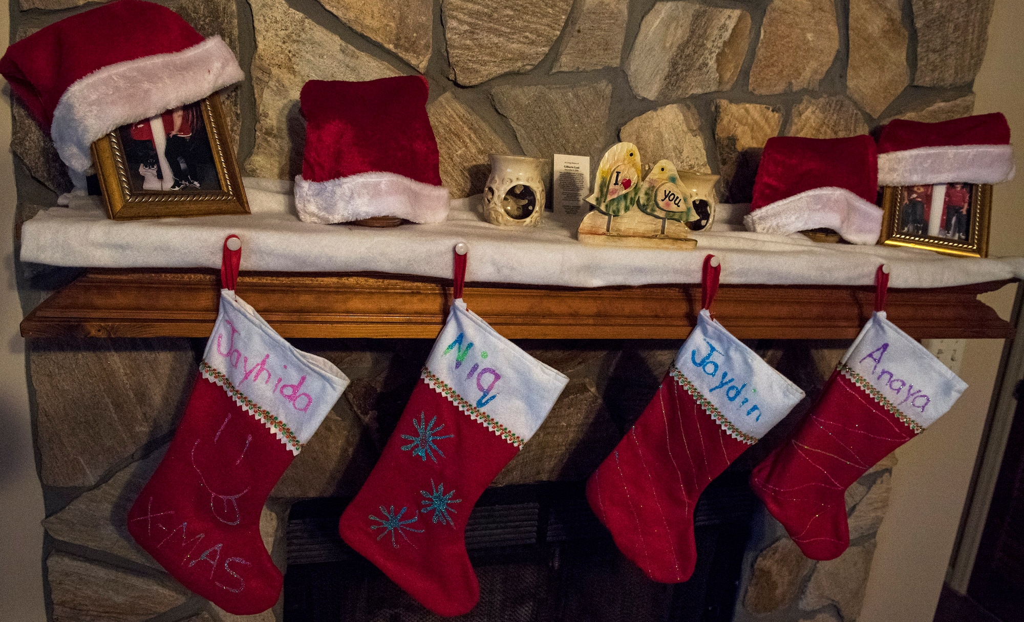 Stockings hang above a fireplace Dec. 23, 2016, in Valdosta, Ga. In the spirit of Christmas, the family of Airman 1st Class Janiqua P. Robinson, 23d Wing photojournalist, decorated their stockings and hung them by the chimney with care, hoping that Santa Claus would soon be there. (U.S. Air Force photo by Airman 1st Class Janiqua P. Robinson)