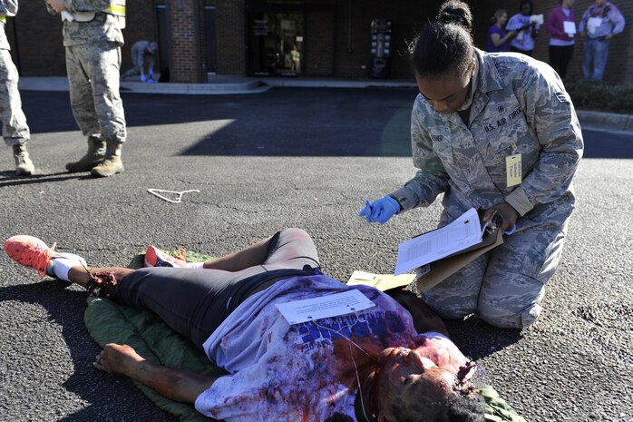 Senior Airman Sasha Fisher, a medical administration technician with the 628th Medical Operations Squadron, updates patient status and information during a mass casualty exercise at Joint Base Charleston, South Carolina, Dec. 21, 2016. The exercise evaluated how medical personnel would respond to an incident on base needing triage, medical care and patient transportation. 