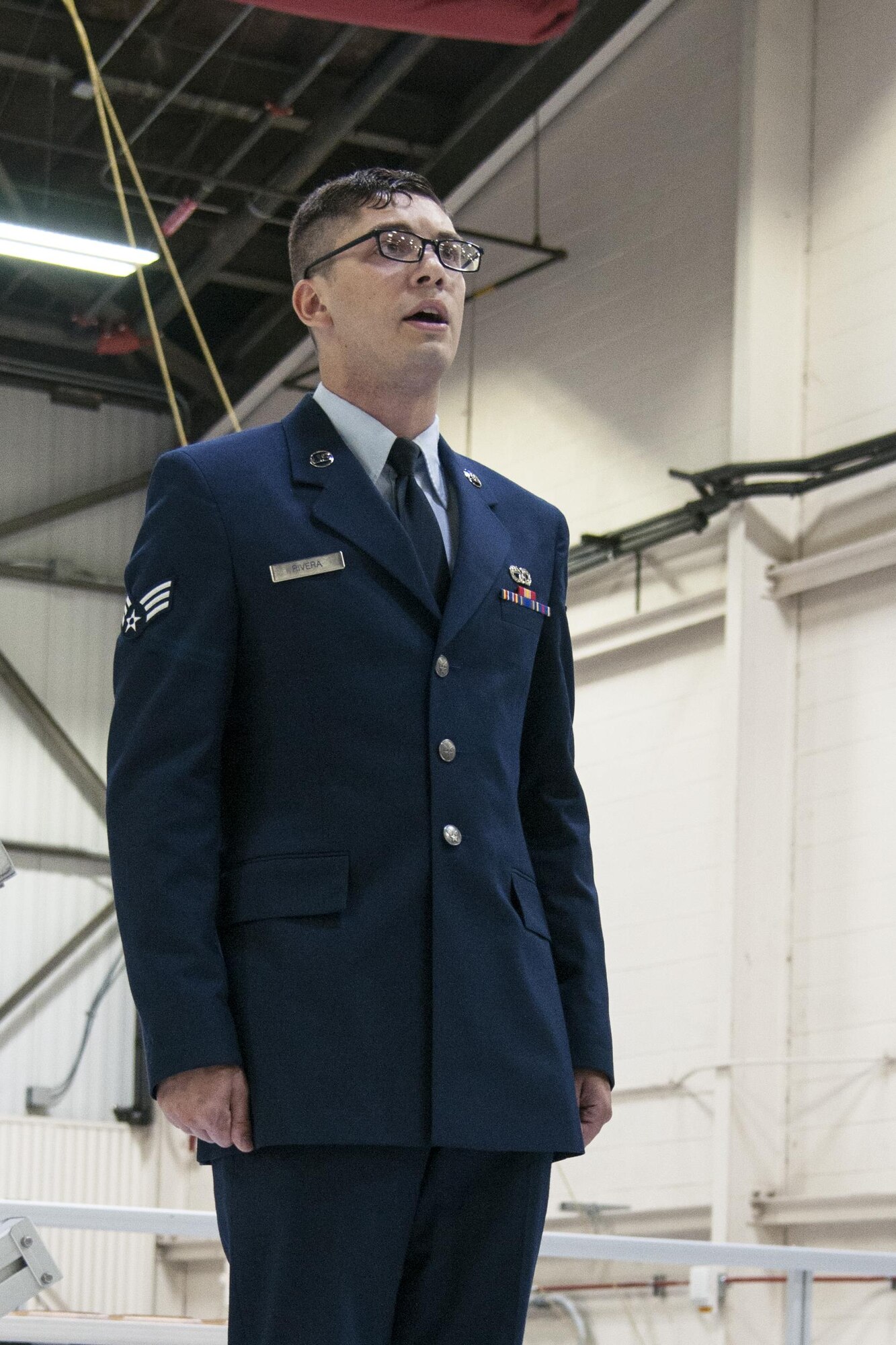Senior Airman, Logan Rivera, 434th Aerial Port aerial port specialist, sings the national anthem during a commander’s call at Grissom Air Reserve Base, Ind. Oct. 1, 2016. Rivera recently traveled to Rome to sing for Pope Francis, head of the Roman Catholic Church. (U.S. Air Force photo/Tech. Sgt. Benjamin Mota)