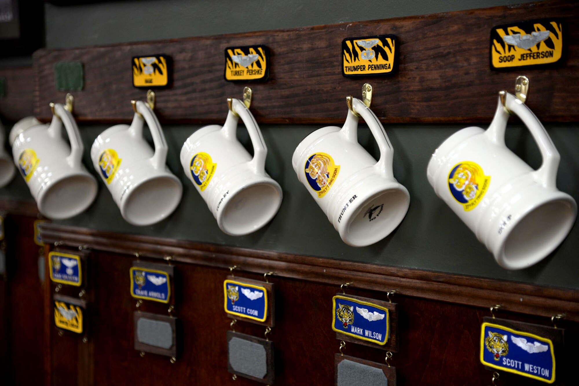The heritage room for the 37th Flying Training Squadron holds many items and pictures of previous incarnations of the 37th FTS at Columbus Air Force Base, Mississippi. Mugs for permanent party personnel are hung along its walls April 12, 2016. (U.S. Air Force photo by Airman 1st Class John Day)