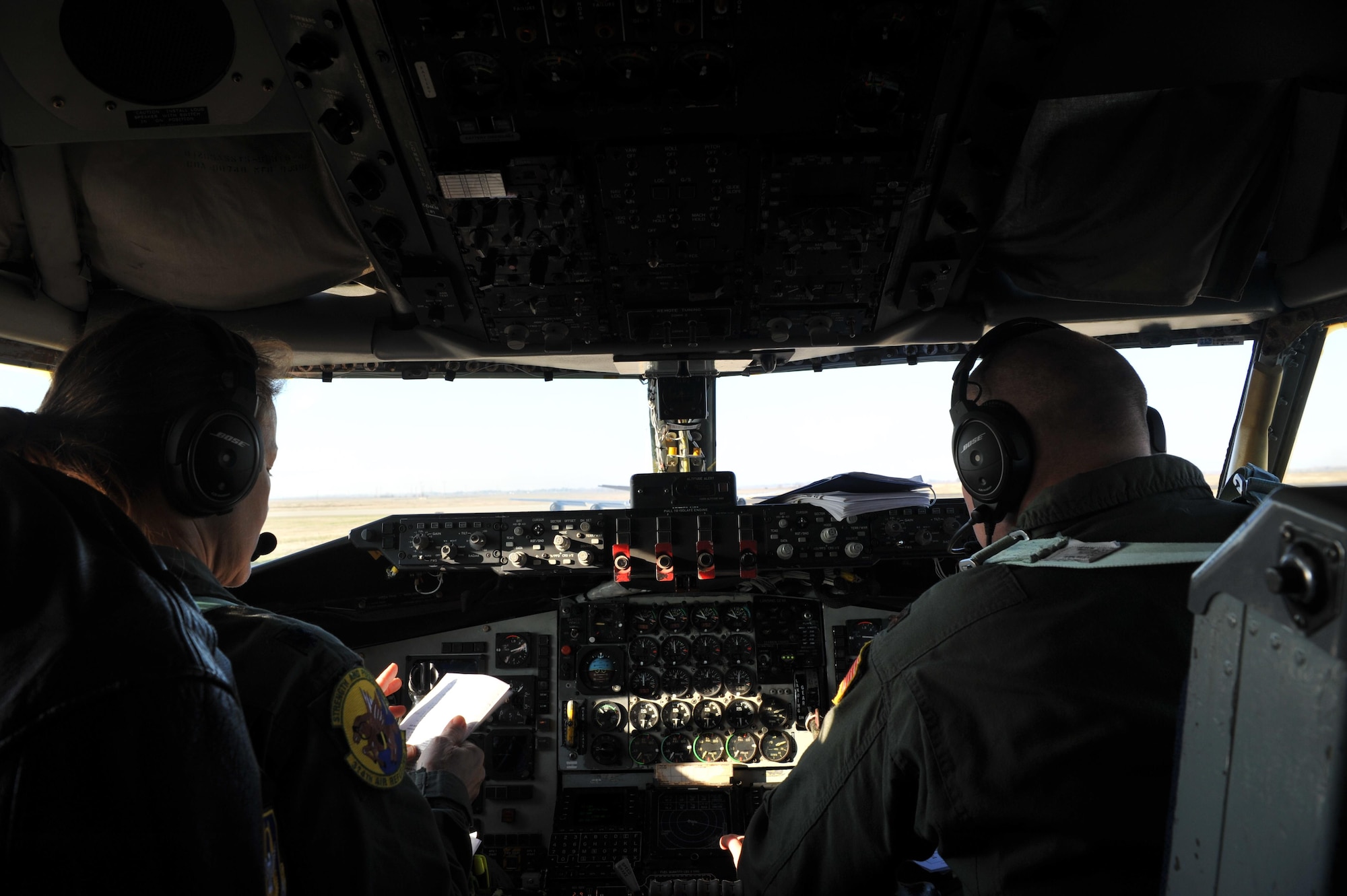 Lt. Col. Jenni Pfafman and Maj. Nathan Walker, 314th Air Refueling Squadron KC-135 Stratotanker pilots, review a preflight checklist Dec. 21, 2016 at Beale Air Force Base, California. Beale recently saw the arrival of the remainder of the 940th Air Refueling Wing’s KC-135s. (U.S Air Force photo/Airman Tristan D. Viglianco)