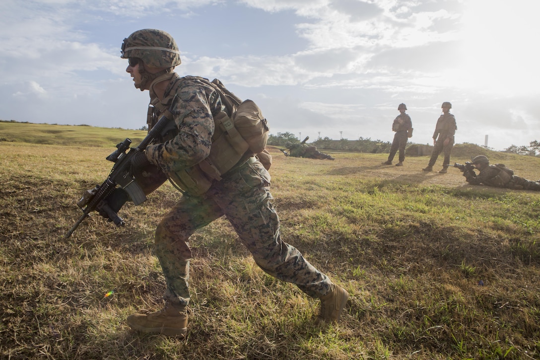 Cpl. Logan Jenkins, an infantry assault Marine with Battalion Landing Team, 2nd Battalion, 5th Marine Regiment, 31st Marine Expeditionary Unit, rushes to his firing position during live-fire and maneuver drills at Camp Hansen, Okinawa, Japan, Dec. 22, 2016. As the Marine Corps' only continuously forward-deployed unit, the 31st MEU air-ground-logistics team provides a flexible force, ready to perform a wide range of military operations, from limited combat to humanitarian assistance operations, through the Indo-Asia-Pacific region.