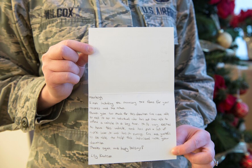 U.S. Air Force Senior Airman Harleigh Wilcox, a 354th Operations Group administration journeyman, holds her letter of appreciation from the Fairbanks Community Food Bank, Dec. 16, 2016, at Eielson Air Force Base, Alaska. Wilcox said her experience was eye-opening, and she encourages people to find unique ways to volunteer or donate. (U.S. Air Force photo by Staff Sgt. Ashley Nicole Taylor)