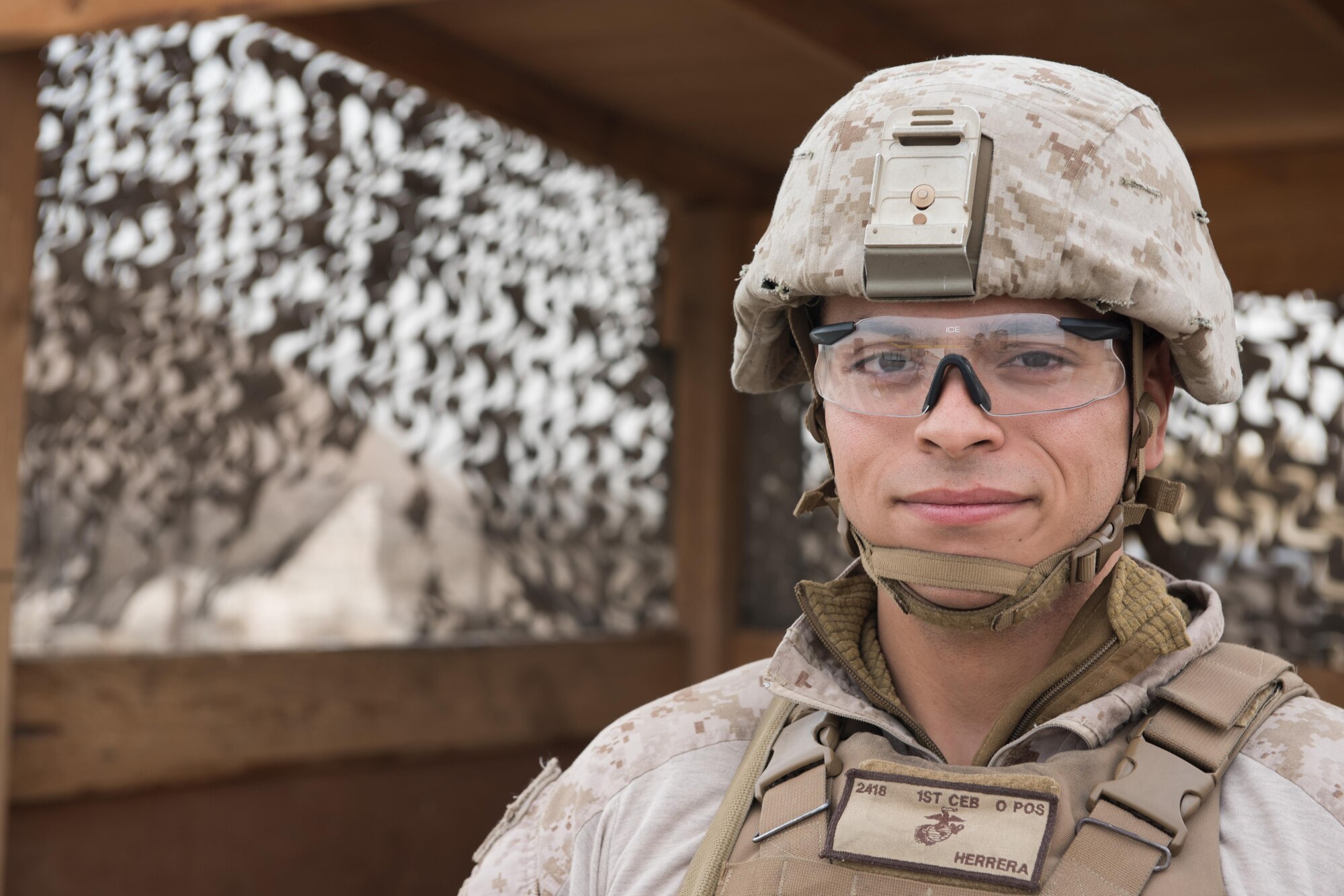 U.S. Marine Corps Lance Cpl. Louie Herrera, 407th Expeditionary Security Forces Squadron, stands watch at an entry control point at an undisclosed location in Southwest Asia, Dec. 25, 2015. Herrera said the highlight of his day was a video call with his wife as she opened the Christmas presents he got her.  (U.S. Air Force photo/Master Sgt. Benjamin Wilson)