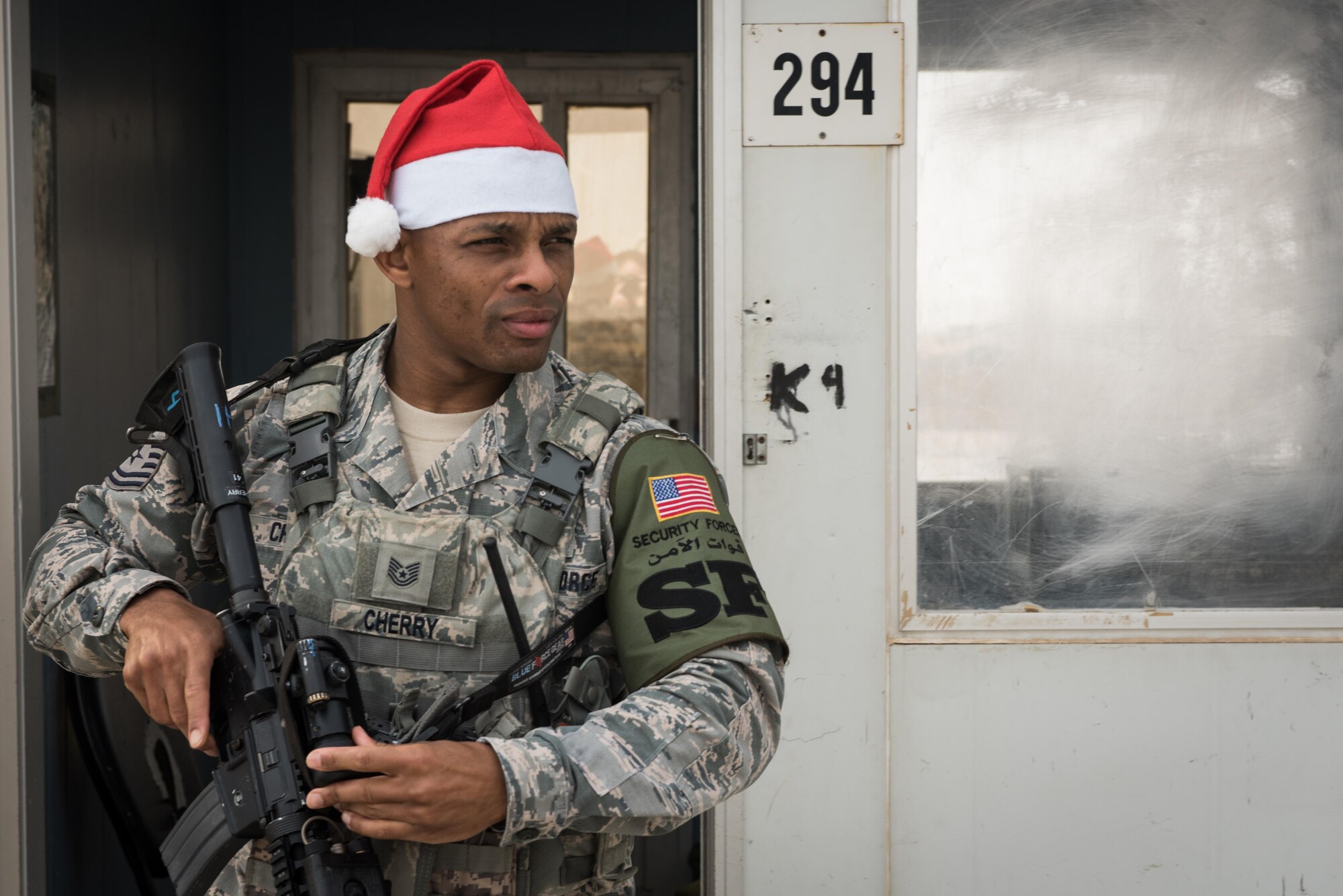 Tech. Sgt. Steven Cherry, 407th Security Forces Squadron, stands watch at an entry control point at an undisclosed location in Southwest Asia, Dec. 25, 2016. Leadership from the 407th SFS stood watch at entry control points around the installation so younger troops could have Christmas Day off. (U.S. Air Force photo/Master Sgt. Benjamin Wilson)
