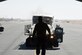 A U.S. Air Force Airman with the 8th Expeditionary Air Mobility Squadron guides an Airman driving a Tunner 60K cargo loader at Al Udeid Air Base, Qatar, Dec. 12, 2016. The 8th EAMS expertise in transportation and logistics enable them to inspect, temporarily store and load cargo such as munitions, blood, special operations cargo, hazardous materials, vehicles and medical supplies. (U.S. Air Force photo by Senior Airman Cynthia A. Innocenti)