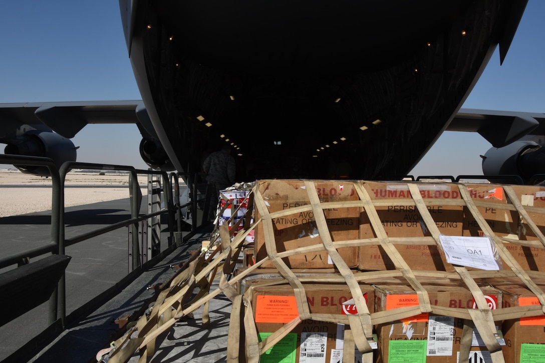 U.S. Air Force Airmen with the 8th Expeditionary Air Mobility Squadron load cargo onto a C-17 Globemaster III at Al Udeid Air Base, Qatar, Dec. 12, 2016. The 8th EAMS expertise in transportation and logistics enable them to inspect, temporarily store and load cargo such as munitions, blood, special operations cargo, hazardous materials, vehicles and medical supplies. (U.S. Air Force photo by Senior Airman Cynthia A. Innocenti)