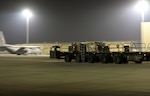 A U.S. Air Force Airman with the 8th Expeditionary Air Mobility Squadron departs from an aircraft driving a Tunner 60K cargo loader at Al Udeid Air Base, Qatar, Dec. 24, 2016. Tunners are used to load and offload heavy cargo, making transport on the flightline quick and efficient. (U.S. Air Force photo by Senior Airman Cynthia A. Innocenti)