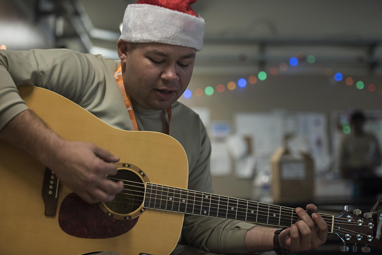 Tech. Sgt. Joe Collett, 455th Expeditionary Aircraft Maintenance Squadron expeditor, plays Christmas Carols Dec. 25, 2016 at Bagram Airfield, Afghanistan. The mission continued over the holiday, but service members took time to celebrate the holiday by talking with their families and spending time with their units. (U.S. Air Force photo by Staff Sgt. Katherine Spessa)