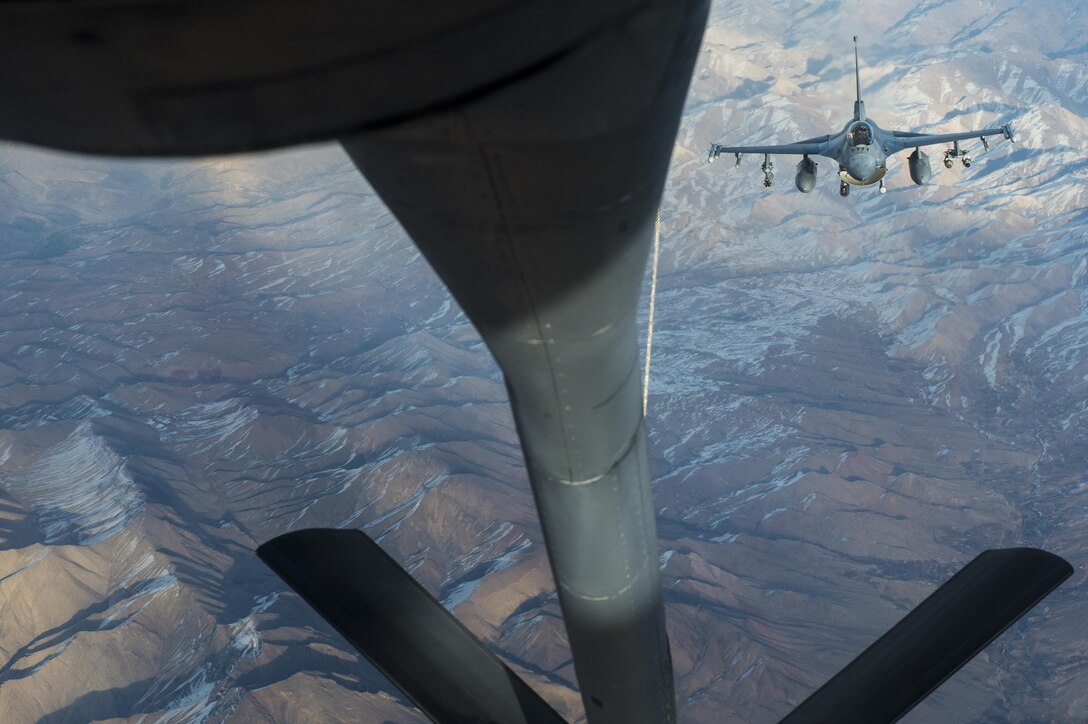 An Air Force F-16 Fighting Falcon approaches a KC-135 Stratotanker for aerial refueling to support an Operation Freedom’s Sentinel mission over Afghanistan, Dec. 21, 2016. The 340th Expeditionary Air Refueling Squadron is actively engaged in tactical refueling operations, which extend kinetic capabilities across Southwest Asia. Air Force photo by Staff Sgt. Matthew B. Fredericks