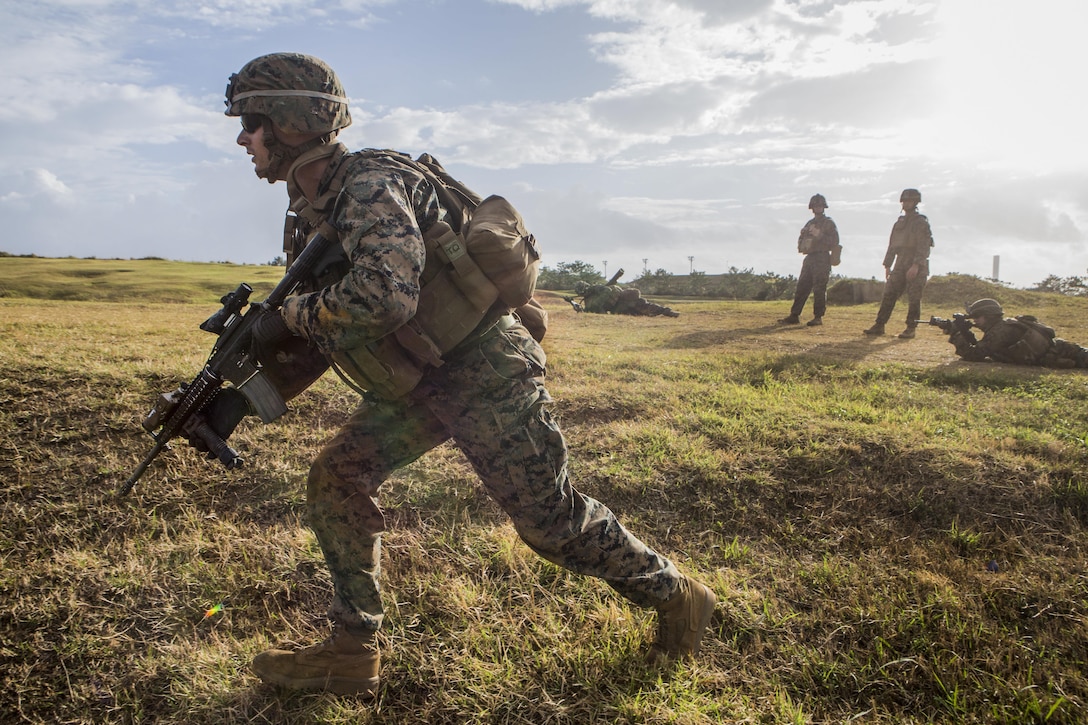 Marine Corps Cpl. Logan Jenkins rushes to his position during live-fire drills at Camp Hansen, Okinawa, Japan, Dec. 22, 2016. Jenkins is an infantry assault Marine assigned to Battalion Landing Team, 2nd Battalion, 5th Marine Regiment, 31st Marine Expeditionary Unit. The  air-ground-logistics team provides a flexible force, ready to perform a wide range of military operations throughout the Indo-Asia-Pacific region. Marine Corps photo by Cpl. Darien J. Bjorndal