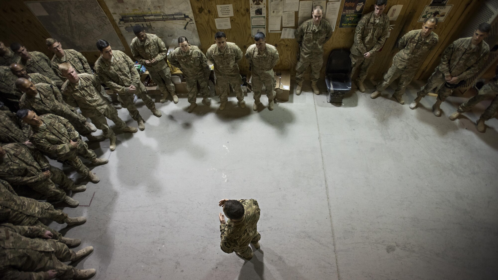 U.S. Air Forces Central Command Chief Master Sgt. Joseph Montgomery speaks to Airmen with the 455th Expeditionary Civil Engineer Squadron during a visit to Bagram Airfield, Afghanistan, Dec. 23, 2016. The chief spoke to Airmen about the importance of keeping in touch with family while deployed. (U.S. Air Force photo by Staff Sgt. Katherine Spessa)