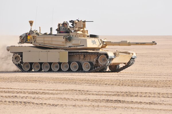 U.S. Army and Kuwaiti Land and Air forces move to engage targets during a joint combined arms live-fire exercise near Camp Buehring, Kuwait Dec. 6-7, 2016. The multi-day exercise was designed to test the efficiency of the forces abilities to identify and eliminate enemies’ anti-aircraft capabilities. Around 30 M1 Abrams Main Battle Tanks, two Kuwaiti AH-64 Apache helicopters, Several Bradley Armored Fighting Vehicles, scout sniper teams, 120mm mortar teams, and M109 Self Propelled Howitzer artillery fire, assaulted mock enemy positions during the exercise. (U.S. Army photo by Sgt. Aaron Ellerman)