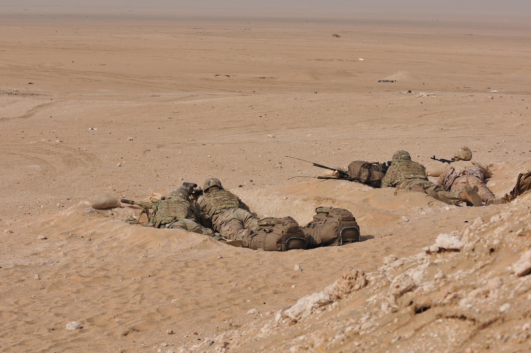 Sniper teams from the 3rd Armored Brigade Combat Team, 1st Armored Division, and Kuwaiti Land Forces engage a target during a joint combined arms live-fire exercise near Camp Buehring, Kuwait Dec. 6-7, 2016. The multi-day exercise was designed to test the efficiency of the U.S. Army and Kuwaiti Land and Air forces abilities to identify and eliminate enemies’ anti-aircraft capabilities. Around 30 M1 Abrams Main Battle Tanks, two Kuwaiti AH-64 Apache helicopters, several Bradley Armored Fighting Vehicles, scout sniper teams, 120mm mortar teams, and M109 Self Propelled Howitzer artillery fire assaulted mock enemy positions during the exercise. (U.S. Army photo by Sgt. Aaron Ellerman)