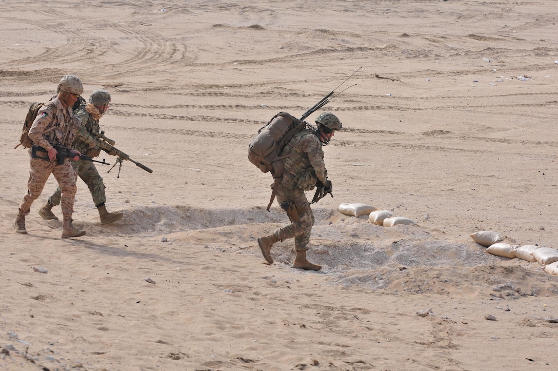 Sniper teams from the 3rd Armored Brigade Combat Team, 1st Armored Division, and Kuwaiti Land Forces engage a target during a joint combined arms live-fire exercise near Camp Buehring, Kuwait Dec. 6-7, 2016. The multi-day exercise was designed to test the efficiency of the U.S. Army and Kuwaiti Land and Air forces abilities to identify and eliminate enemies’ anti-aircraft capabilities. Around 30 M1 Abrams Main Battle Tanks, two Kuwaiti AH-64 Apache helicopters, several Bradley Armored Fighting Vehicles, scout sniper teams, 120mm mortar teams, and M109 Self Propelled Howitzer artillery fire assaulted mock enemy positions during the exercise. (U.S. Army photo by Sgt. Aaron Ellerman)