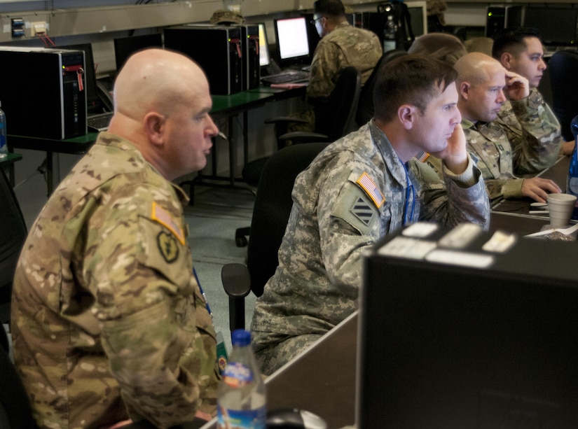 Soldiers from both the 79th Sustainment Command (Support), and the 13th Sustainment Command (Expeditionary) collaborate during Exercise Judicious Response '17 in Kaiserslautern, Germany Dec. 4, 2016. (U.S. Army Photo by Sgt. 1st Class Alexandra Hays, 79th Sustainment Command (Support).