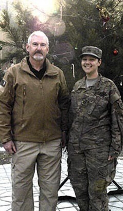 Army Lt. Col. John Dismer and his daughter, Army Pfc. Kathryn Davis-Rice, who are deployed to different parts of Afghanistan, pose for a photo whjile sharing time together at the Resolute Support mission headquarters in Kabul, Afghanistan, Dec. 18, 2016. Navy photo by Lt. Lauren Sucher