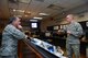 Gen. David L. Goldfein, Chief of Staff of the Air Force, listens to 1st Lt. Mark Skinner, 2nd Space Operations Squadron GPS mission commander, explain current 2 SOPS activities during his visit at Schriever Air Force Base, Colorado, Tuesday, Dec. 20, 2016. Goldfein toured various squadrons across the base during his visit, receiving in-person briefings and engaging with Airmen. (U.S. Air Force photo/Christopher DeWitt)